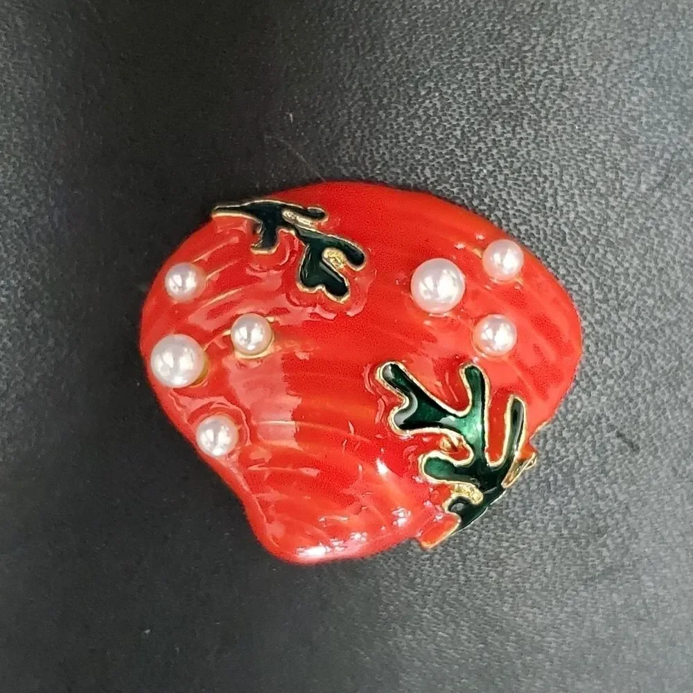 Gold tone orange enamel shell brooch faux pearl